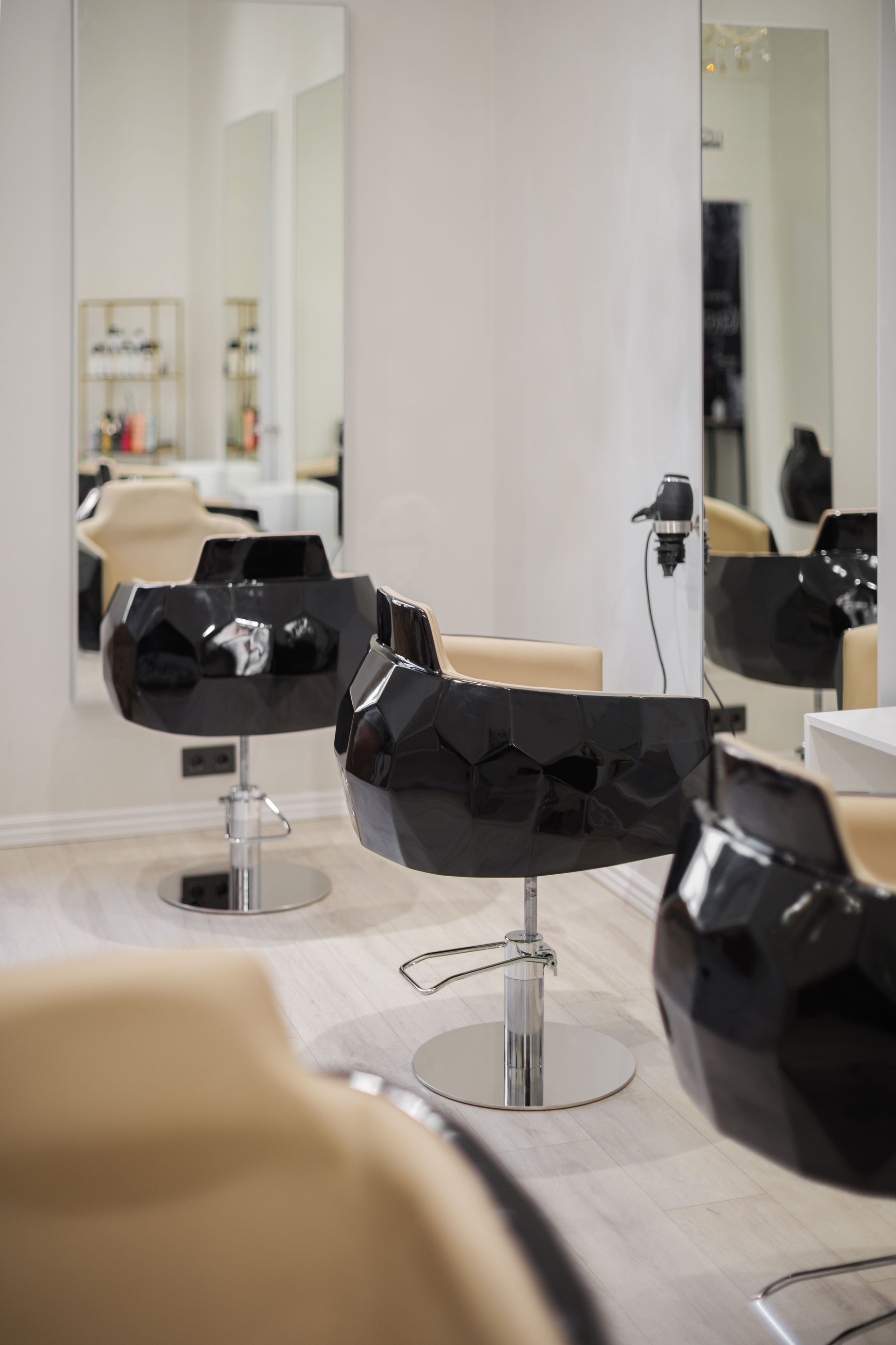 Interior of beauty salon with chairs and mirrors. Furniture in modern hairdressing